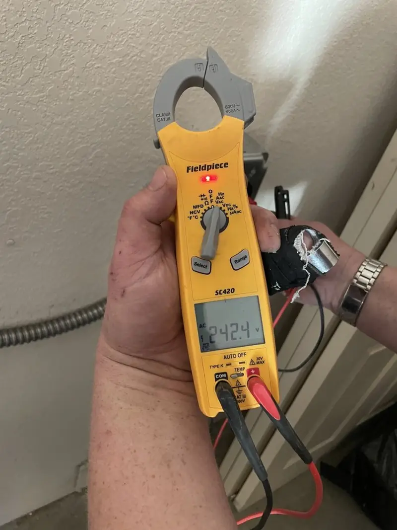 Voltage testing with clamp meter during Hot Tub / Pool Electrical Wiring in Waynesville